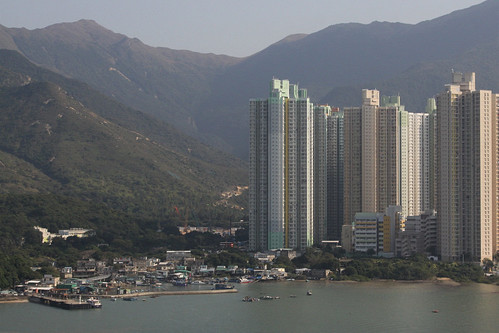 Modern apartment blocks tower above the old fishing village on Tung Chung Bay