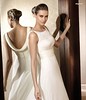 Sleeveless silk wedding dress decorated with lace and belt