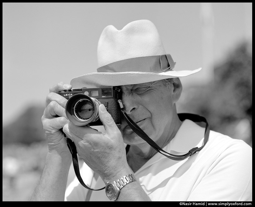 Photographer using a Leica 35mm film camera