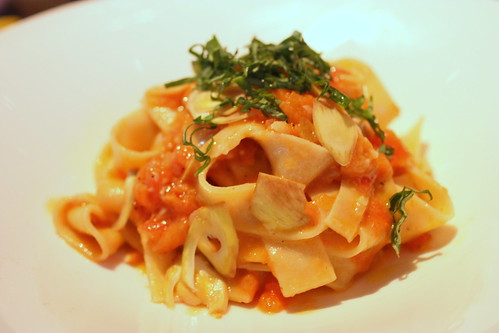 handmade papperdelle with tomatoes, artichokes, and fresh basil