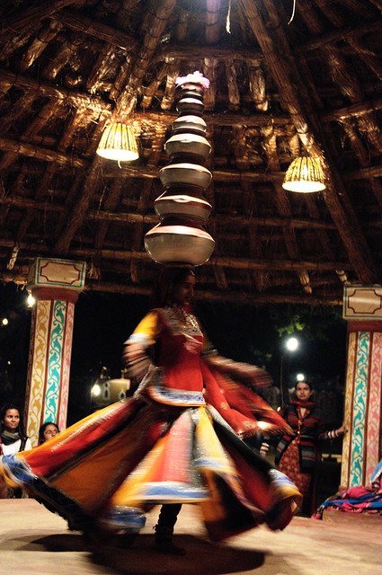 Folk dancer with pots on her head