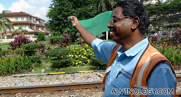 Mr Manikavasam at work with his flag