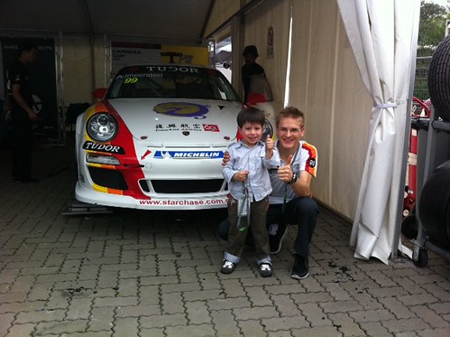 Scott with Alexandre Imperator and his car in the Porsche Carrera Cup Asia area