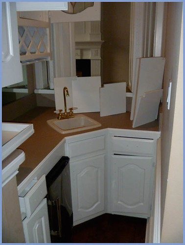 painting kitchen cabinets white. DFW Painting refinished these kitchen cabinets to a beautiful white after