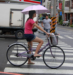 girl and umbrella on bike