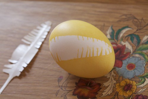 yellow egg with feather