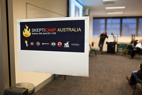 Skepticamp Sydney 2011 sign, posted on a clear glass door