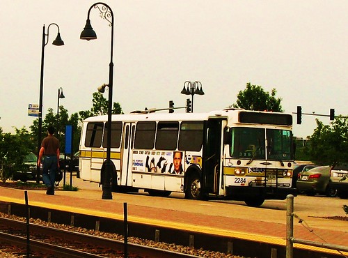 Pace bus waiting at The Glen of North Glenview Metra commuter rail station. Glenview Illinois USA. June 2011. by Eddie from Chicago