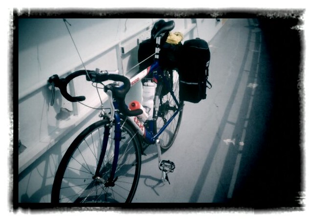 Loaded bike sitting on other forms of transport, ferry edition.