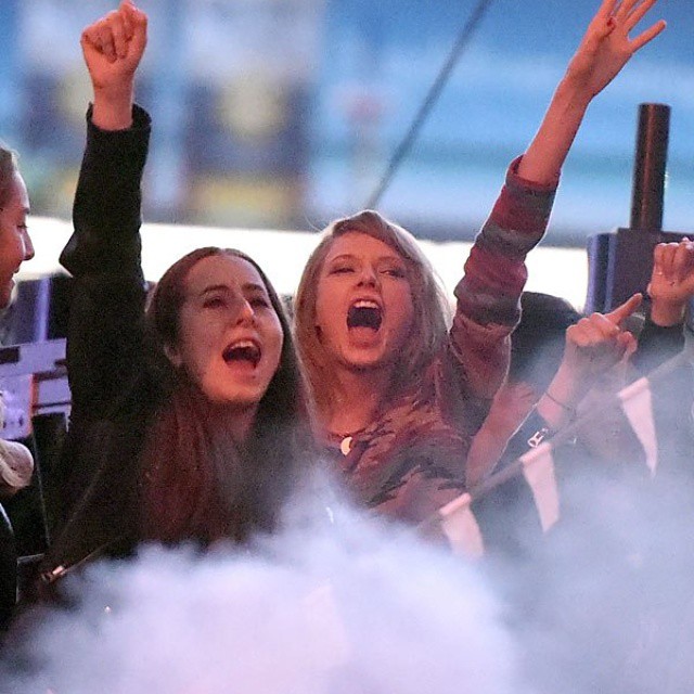 Musicians Alana Haim of HAIM (L) and Taylor Swift watch from backstage as CALVIN HARRIS performs onstage during 102.7 KIIS FM’s 2015 Wango Tango at StubHub Center on May 9, 2015 in Los Angeles, California. (Photo by Kevin Winter/Getty Images For 102.7 KII