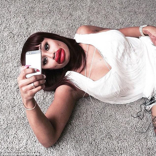 BLAC CHYNA takes aim at Kylie Jenner with picture of herself wearing fake lips
