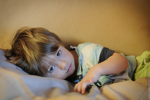 Boy lying on pillows. ©  Evgeniy Isaev