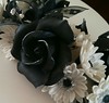 Black and white flower paste cake and topper.