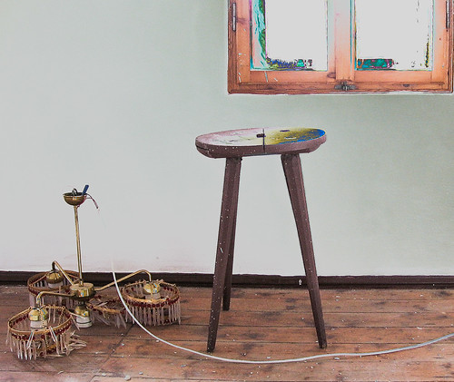 Still life with stool and downed chandelier ©  Raymond Zoller