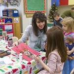 A student helping in the preschool