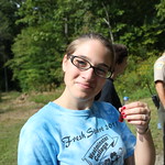 A student holding up a sample collected outside.