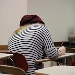 A student taking notes during class.