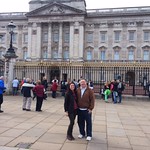 Professors pose for a photo in front of Buckingham Palace