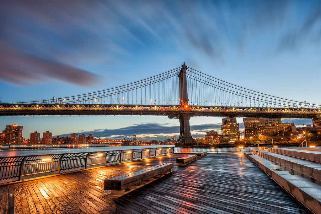 A long exposure of the Manhattan Bridge during a gorgeous sunrise in New York City.