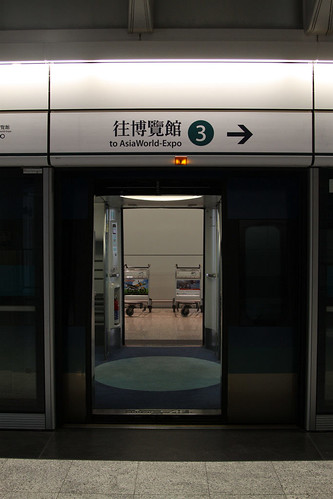 Looking through the train at at Airport station: both doors open, as there is a platform either side