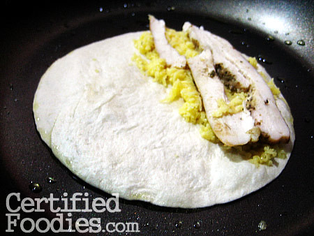 Making the Quesadilla, with chicken strips and cheese - CertifiedFoodies.com