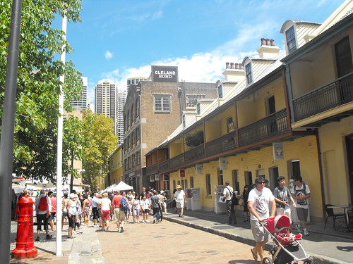 people walking down a city street