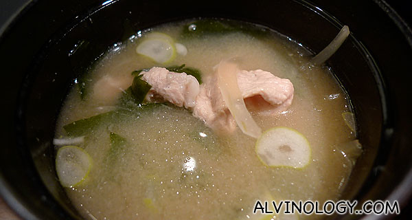 Visible pork bits and vegetable in the miso soup