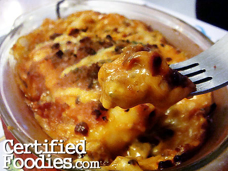 A spoonful of creamy lasagna... yum! - blankPixels.com