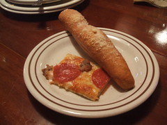 Breadstick and meaty slice