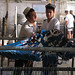 Uyghur men sorting strands of dyed silk - Hotan, Xinjiang