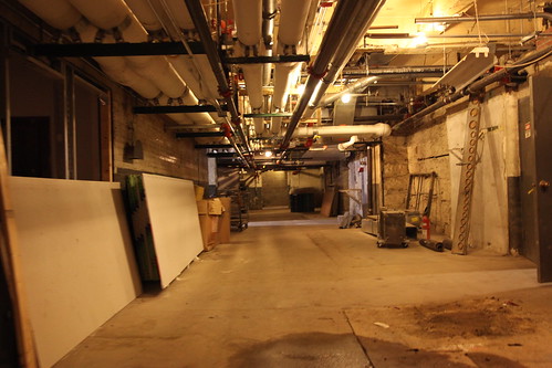 Overhead pipes in main basement corridor