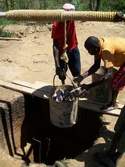 Lowering stones down into the well