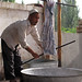 Twisting silk to remove excess water - Hotan