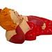 art, figurine, papermache, lady in red lying,  side