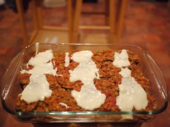 Assembling moussaka in a baking tray