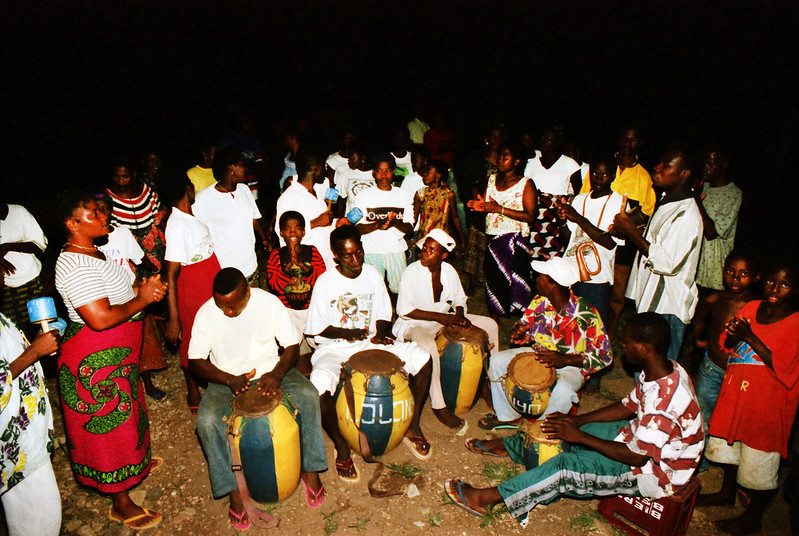Togo West Africa Ethnic Cultural Dancing and Drumming African Village close to Palimé formerly known as Kpalimé a city in Plateaux Region Togo near the Ghanaian border 24 April 1999 125 Drumming<br/>© <a href="https://flickr.com/people/41087279@N00" target="_blank" rel="nofollow">41087279@N00</a> (<a href="https://flickr.com/photo.gne?id=13988028244" target="_blank" rel="nofollow">Flickr</a>)