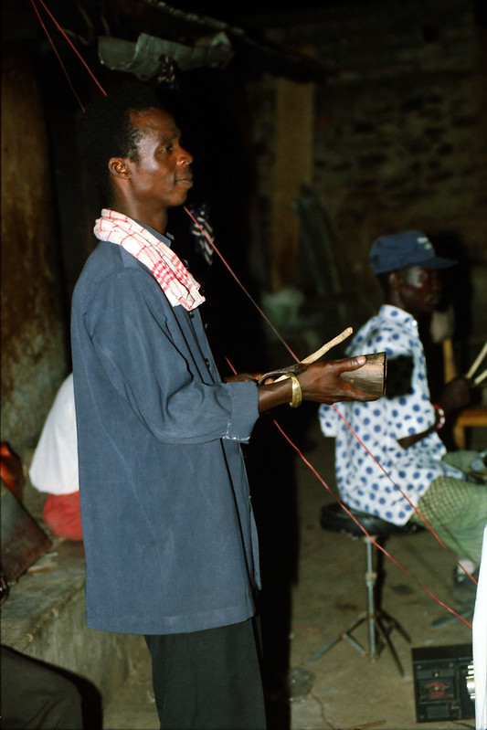Togo West Africa Local Ethnic Cultural Orchestra Band and Show African Village close to Palimé formerly known as Kpalimé a city in Plateaux Region Togo near the Ghanaian border 23 April 1999 112<br/>© <a href="https://flickr.com/people/41087279@N00" target="_blank" rel="nofollow">41087279@N00</a> (<a href="https://flickr.com/photo.gne?id=13956799566" target="_blank" rel="nofollow">Flickr</a>)