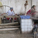 Uyghur women extracting silk - Hotan, Xinjiang