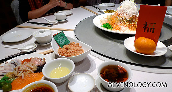 The restaurant's unique Yu Sheng comes with a spicy sauce and an assortment of fresh seafood