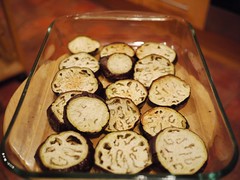 Layering aubergines on a baking dish
