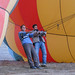Men hold hot air balloon in place - Goreme, Cappadocia, Turkey