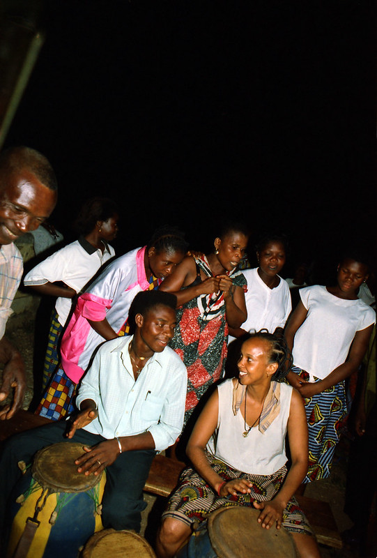 Togo West Africa Ethnic Cultural Dancing and Drumming African Village close to Palimé formerly known as Kpalimé a city in Plateaux Region Togo near the Ghanaian border 24 April 1999 104 Fouzia Drumming<br/>© <a href="https://flickr.com/people/41087279@N00" target="_blank" rel="nofollow">41087279@N00</a> (<a href="https://flickr.com/photo.gne?id=13976706811" target="_blank" rel="nofollow">Flickr</a>)