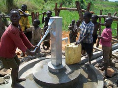 Kids use the new pump in Kitumu
