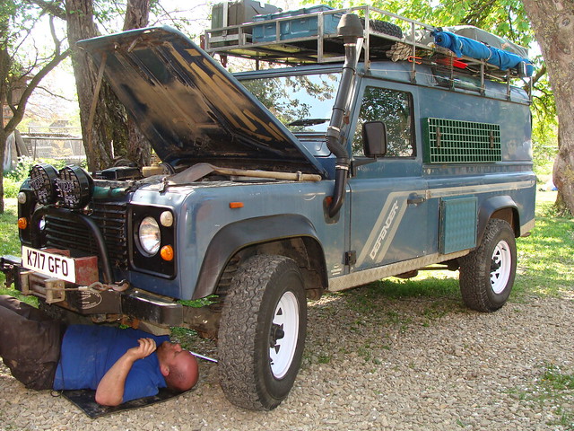 Dave performing maintenance work on Ollie & Jenny's Defender