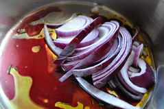 Cook chopped onion with wine and oil over medium heat