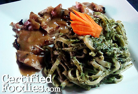 Creamy pesto pasta and grilled chicken with gravy, with that weird carrot garnish - blankPixels.com