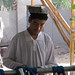 Uyghur man sorting strands of dyed silk - Hotan, Xinjiang