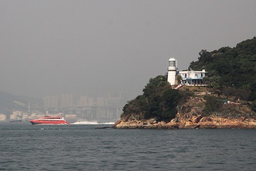 TurboJet catamaran passing the lighthouse on Green Island