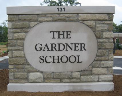Outdoor monument sign with flat cut metal dimensional letters
