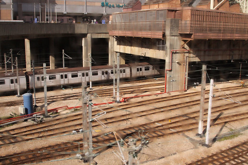 Train entering the sheds at Kowloon Bay depot: buildings on the podium as with every other MTR depot